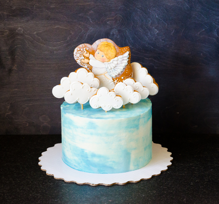 baptizing blue cream cake with gingerbread cookiesの写真素材