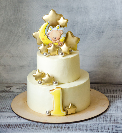 two layered baby boy cake with teddy bear gingerbreadの写真素材