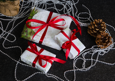 Christmas hand made present boxes decorated with lace and ribbonsの写真素材