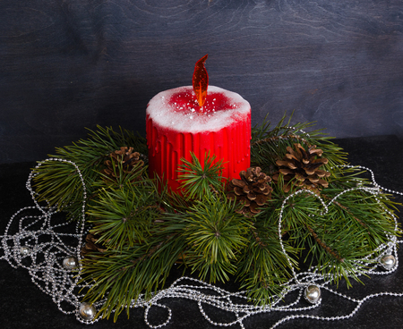 Christmas candle cake with caramel flame decorated with pine treeの写真素材