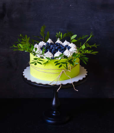 Green Cream cheese cake with blueberries, marshmallow and pistachioの写真素材