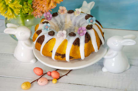 Easter cake holiday outlay with wooden decorationの写真素材