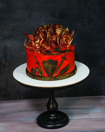 Fantastic red cake with gilded decorationの写真素材