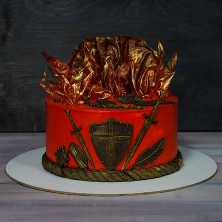 Fantastic red cake with gilded decorationの写真素材