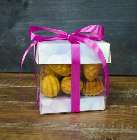 Retro sweets with caramel on wood in gift boxの写真素材