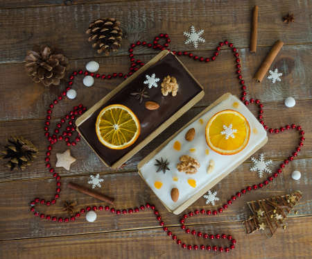 Chocolate orange Christmas cake with fir tree and other decorationの写真素材
