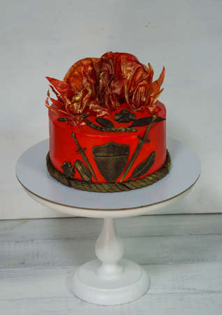Fantastic red cake with gilded decorationの写真素材