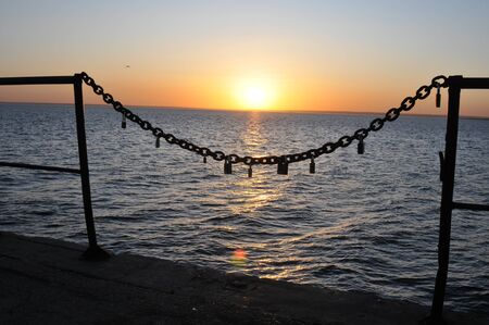 early morning, any time of the year, the sun rises over the seeの写真素材