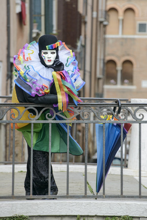 Man with colorful umbrella on the deckの写真素材