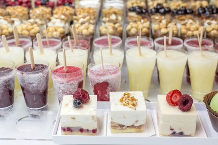 mini ice cream with various colors in the glassesの写真素材