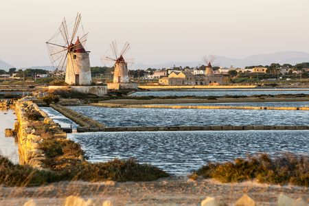 Pans of Trapani with windmills, in Sicilyの写真素材