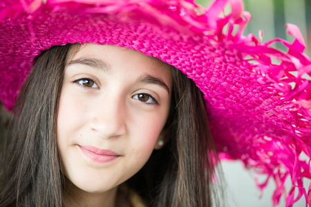 portrait of little girl with hat and long hairの写真素材