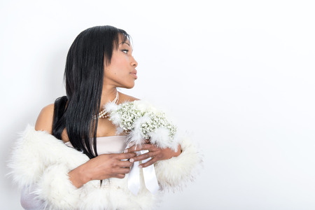 portrait of a beautiful girl dressed in white in studioの写真素材