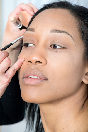 hair and makeup of a beautiful black girl in studioの写真素材