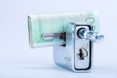 deadbolt with European banknotes and key in still lifeの写真素材