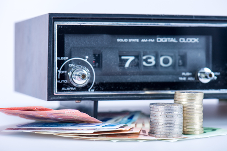 old radio with European money, the radio sign the clock 7:30の写真素材