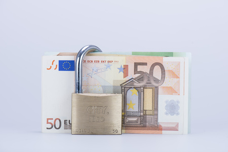 euro money in closed padlockの写真素材