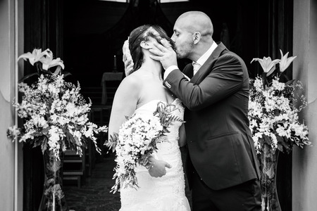 newlyweds who leave the church with smiledの写真素材