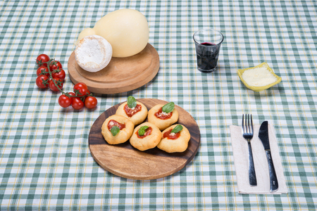 Deep-fried pizza is a dish consisting of a pizza that instead of being baked in an oven is deep-fried, resulting in a different flavor and nutritional profile.の写真素材