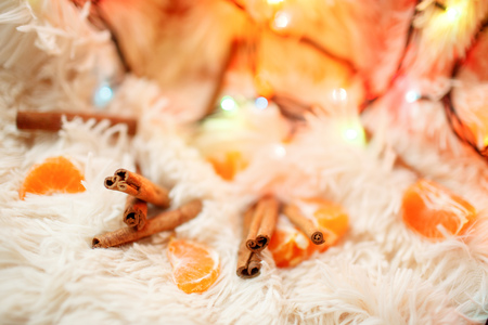 cinnamon sticks, tangerine on the warm soft backgroundの写真素材