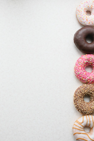 Three colored donut glaze, right, left room for design or text.の写真素材