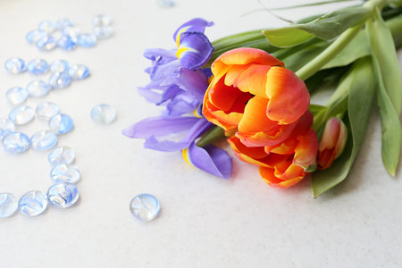 Bouquet of irises and tulips and inscription love on a light background. An offer of marriage.の写真素材