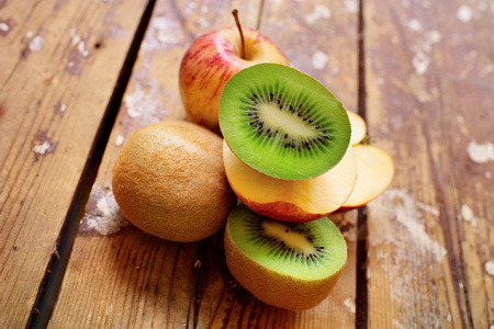 Kiwi and apples. Dietary food on a wooden background.の写真素材