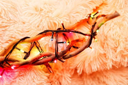 New Year and Christmas decorations. A lamb decorated with garlands.の写真素材