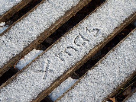The inscription xmas on the snow. Beautiful Christmas background.の写真素材