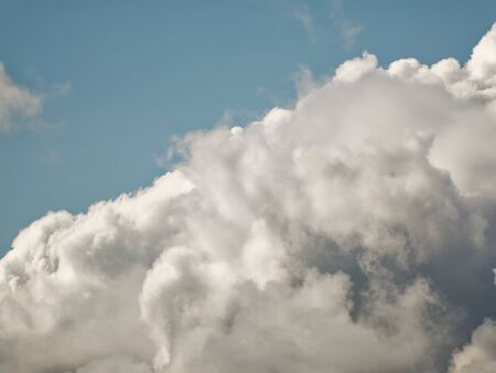 The sky with beautiful cumulus clouds. Restrained pastel colors.の写真素材