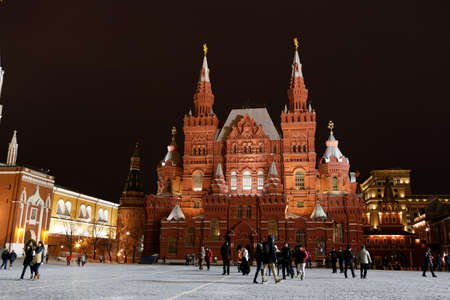 MOSCOW, RUSSIAN FEDERATION - February 18, 2015. History Museum on Red Square at night. Tourists on the Red Square.のeditorial素材