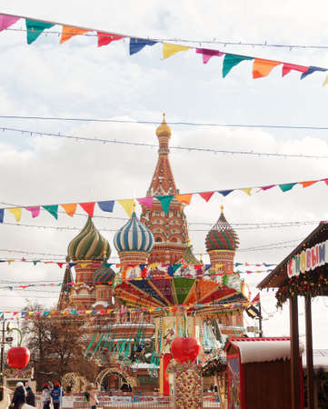 MOSCOW, RUSSIA - December 01, 2019. New Year's fair on Red Square in Moscow. Carousel in front of St. Basil's Cathedral.のeditorial素材