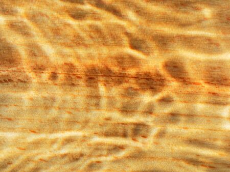 Yellow wooden background with stains. Light stained.の写真素材
