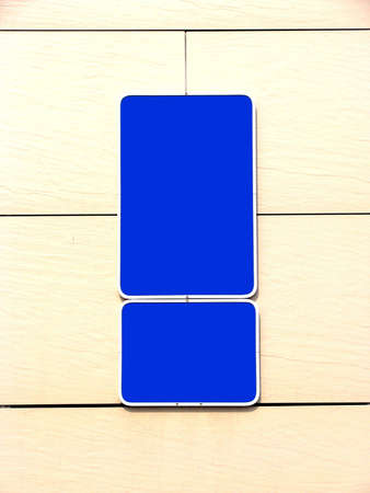 Blue blank signs on the wallの写真素材