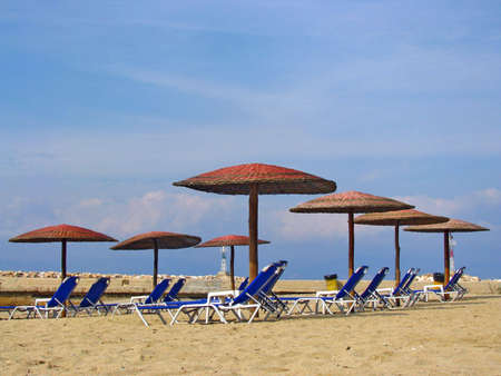 Parasols on sandy Mediterranean beachの写真素材