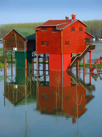 Red houses and flooding riverの写真素材