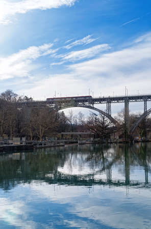 BERN, SWITZERLAND - MARCH 3, 2019: The Kirchenfeld bridge, located above river Aare in the center of Bern, is a hingeless arch bridge in a riveted welded iron construction, built in 21 months and inaugurated on 24 September 1883.のeditorial素材