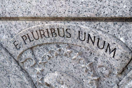 Washington, D.C., USA - November 11, 2017: Words E Pluribus Unum above United States seal, carved into stone on the World War II Memorial located on the National Mall.のeditorial素材