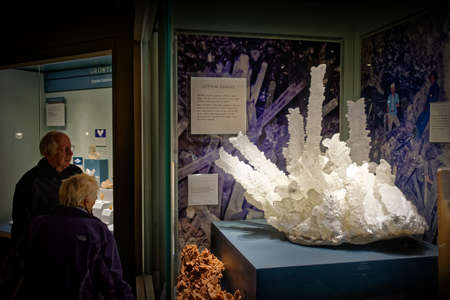 Washington, D.C., USA - November 13, 2017: Museum visitors looking at large gypsum crystals in the Hall of Geology, Gems, and Minerals, located in the Smithsonian National Museum of Natural History.のeditorial素材