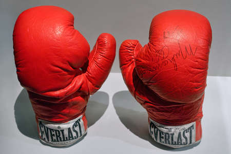 Washington, D.C., USA - November 14, 2017: Autographed boxing gloves, which American professional boxer Muhammad Ali used in about 1974, are displayed in the National Museum of American History.のeditorial素材