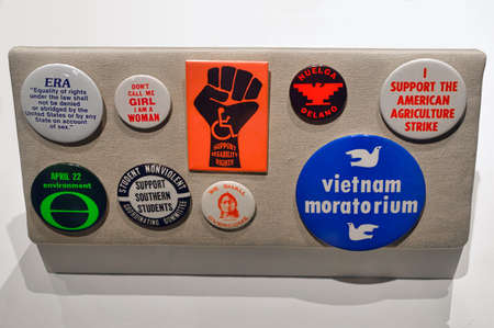 Washington, D.C., USA - November 14, 2017: Old U.S. pinback buttons dealing with various issues, including The Vietnam War, human rights and environment.のeditorial素材