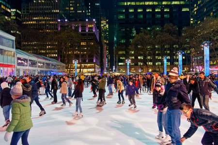 New York City, USA - December 2, 2017: Large number of people skating on the Winter Village ice rink at Bryant Park, Manhattan.のeditorial素材