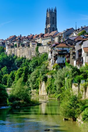 The medieval town centre of Fribourg (Freiburg) situated on a rocky outcrop high above the River Saane (Sarine), Switzerlandの写真素材
