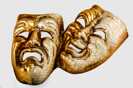 Two theatrical mask sadness and joy photographed on white backgroundの写真素材