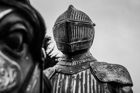 Black and white picture of a knight in armor who rides on the horseの写真素材