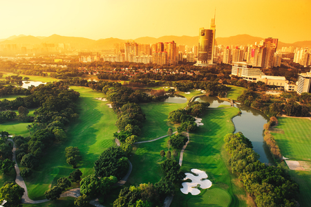 Golf course in the city of Shenzhen in the eveningの写真素材