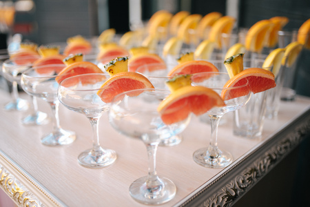 Rows of empty glasses prepared for receptionの写真素材