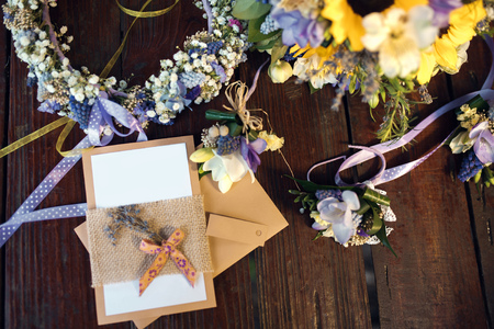 Closeup shot of the wedding bouquet, wreath and invitations  at daylightの写真素材