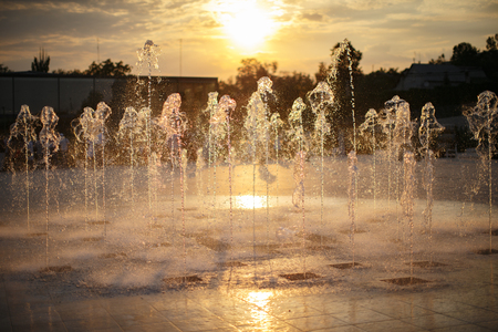 Small fountain with water streams beating from belowの写真素材