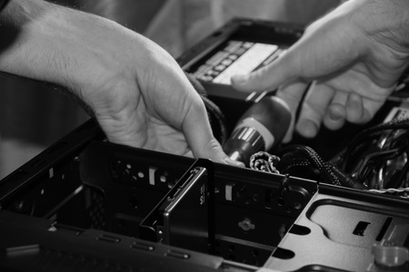 Computer repair with a screwdriverの写真素材